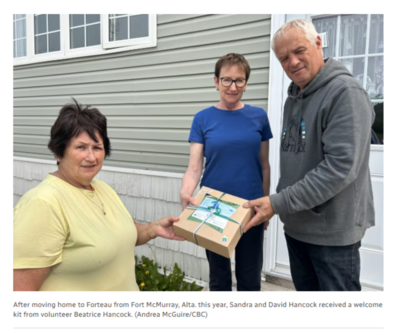 After moving home to Forteau from Fort McMurray, Alta. this year, Sandra and David Hancock received a welcome kit from volunteer Beatrice Hancock. (Andrea McGuire/CBC) After moving home to Forteau from Fort McMurray, Alta. this year, Sandra and David Hancock received a welcome kit from volunteer Beatrice Hancock. (Andrea McGuire/CBC)